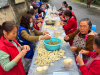 新都区新都街道高筒社区 “巧手包水饺・重阳乐融融”活动